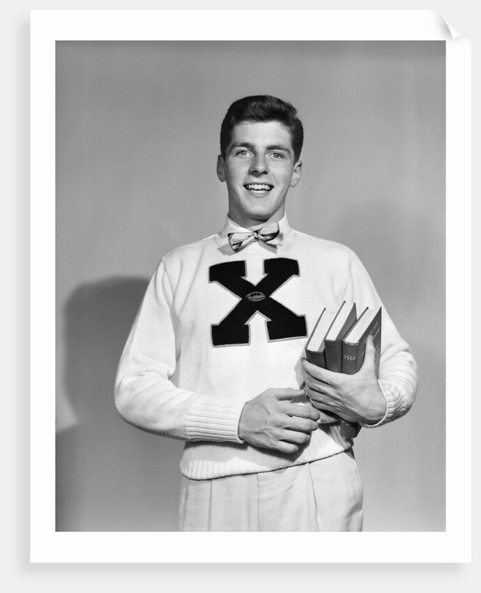 1940s 1950s Portrait Boy Student Carrying Books Wearing Football Letter Sweater by Anonymous