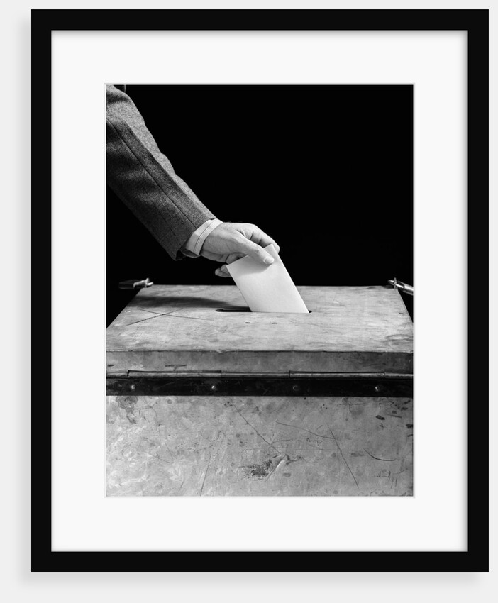 1930s 1940s Man's Hand Putting Ballot In Slot In Box by Anonymous
