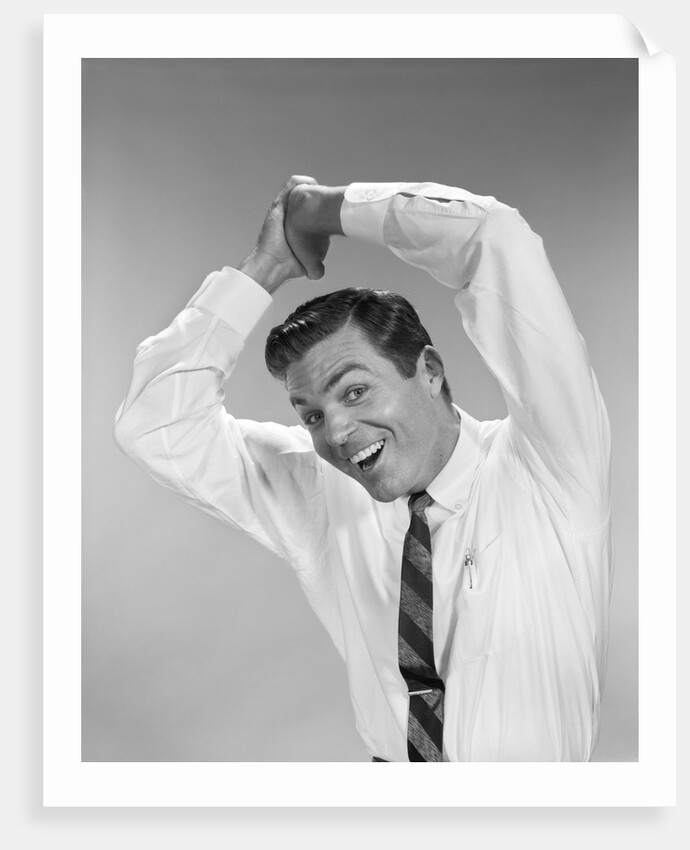1960s Businessman In Shirtsleeves Clasping Hands Together Overhead by Anonymous