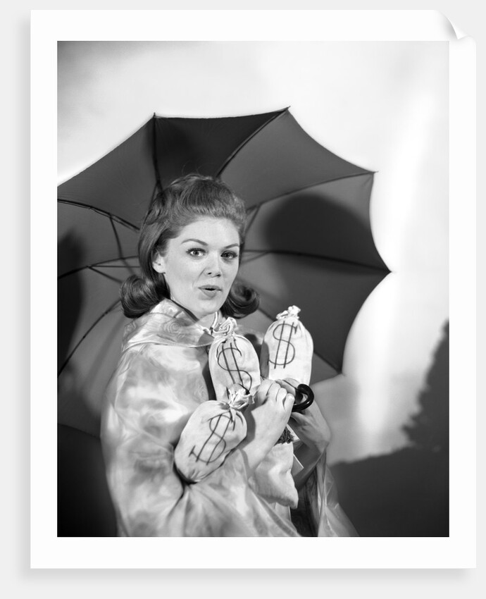 1960s Woman With Umbrella Holding Bags Of Money Save Your Money For A Rainy Day by Anonymous