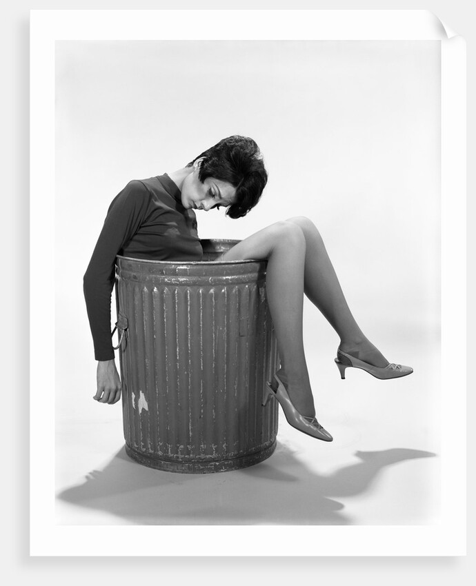 1960s Young Woman In Trash Can by Anonymous