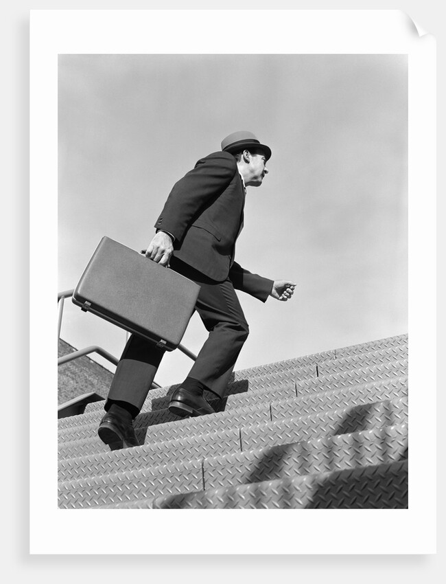 1960s Salesman Briefcase In Hand Climbing Steep Hard Steel Tread Stairs by Anonymous