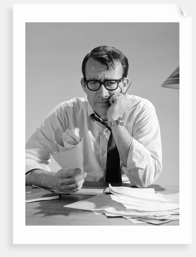 1960s Man With Pile Of Bills And Worried Expression by Anonymous