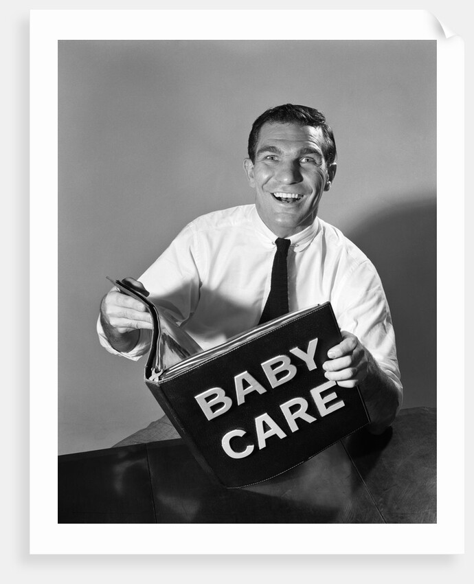 1960s Man Father Holding Baby Care Book by Anonymous