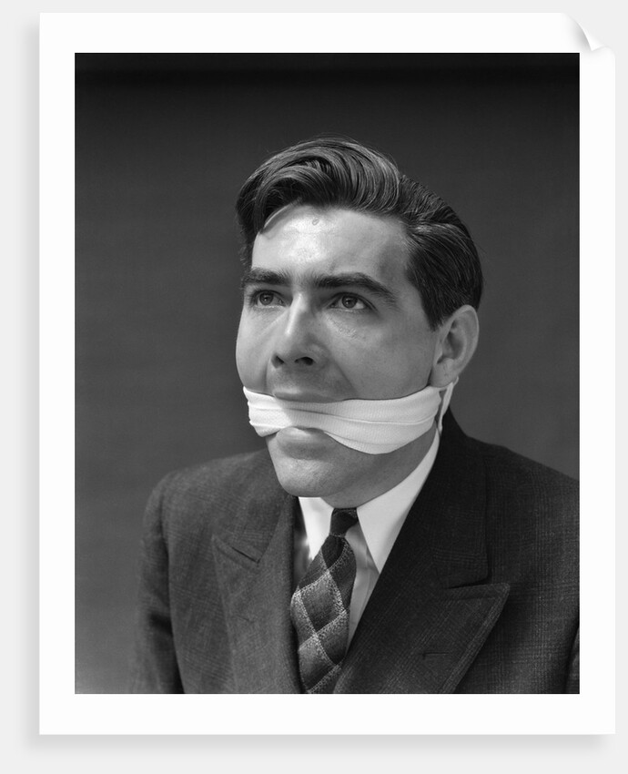 1930s Portrait Of Man With Gag In Mouth by Anonymous