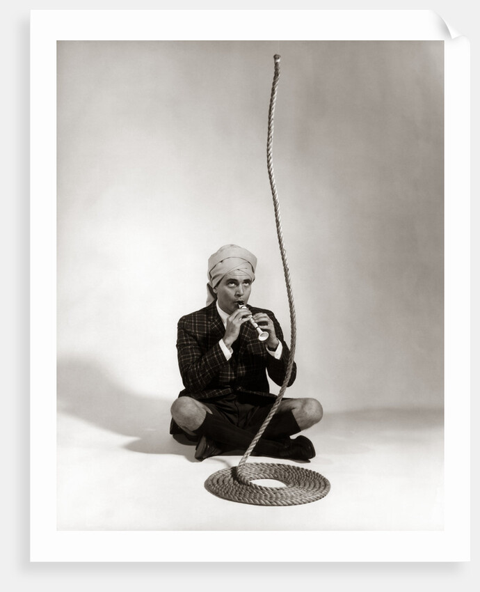 1960s Man Snake Charmer Character In Turban Plaid Jacket Shorts Knee Socks by Anonymous