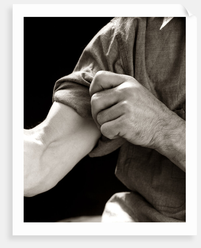 1920s 1930s 1940s 1950s Man Rolling Up Sleeve Symbolic Get To Work by Anonymous