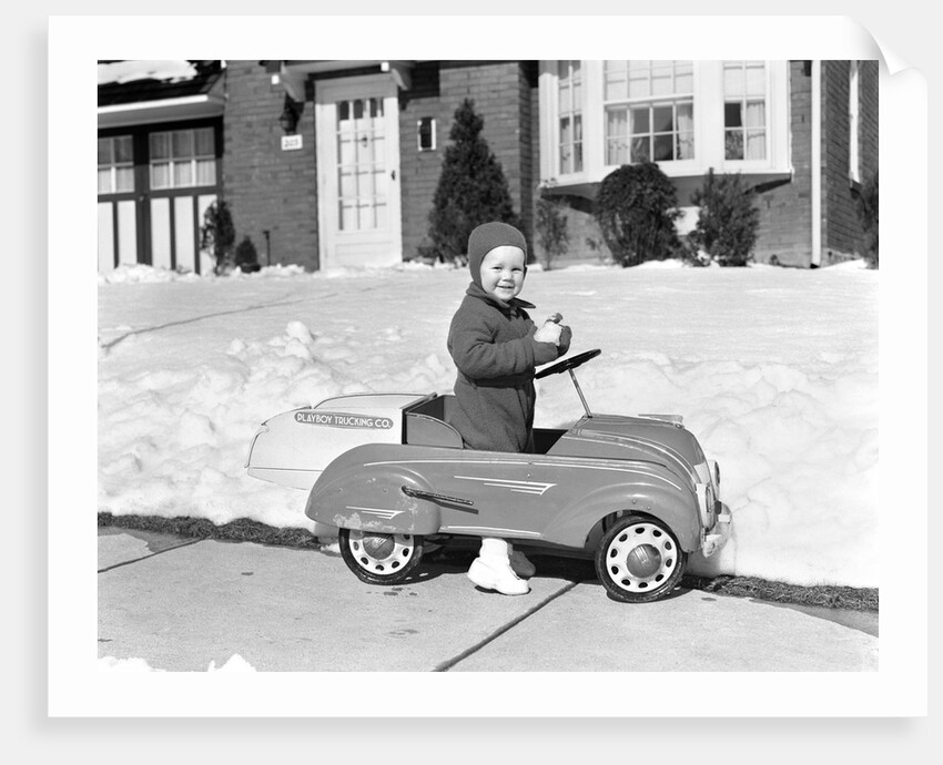 1930s 1940s Little Boy Playing In Toy Car Outside In Snow by Anonymous