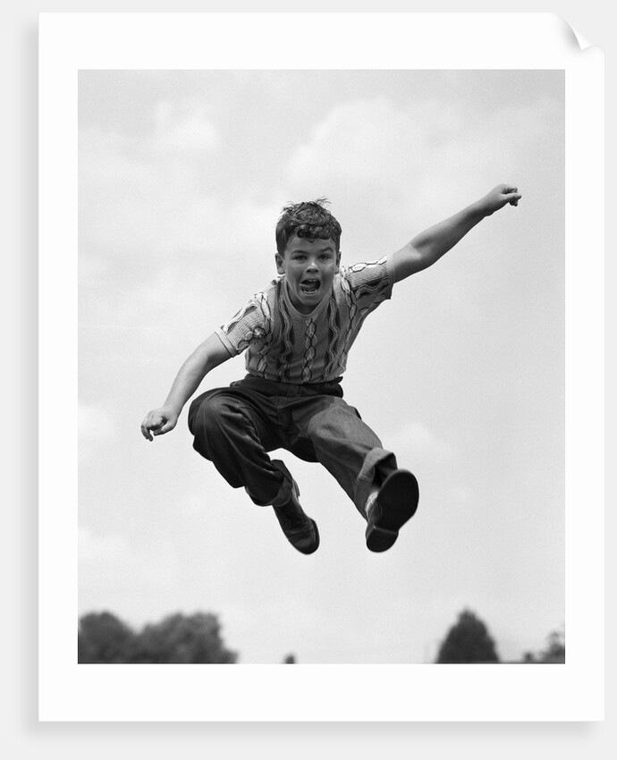 950s Boy Jumping Up by Anonymous