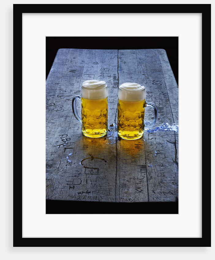 Two Glass Mugs of Beer on Table by Anonymous