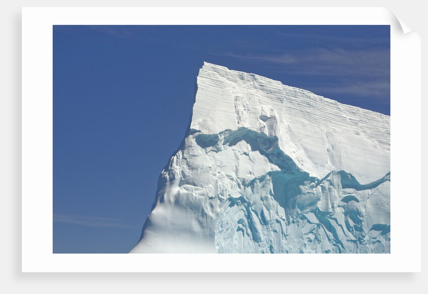 Pointy Blue Iceberg Sculpted by Waves by Anonymous