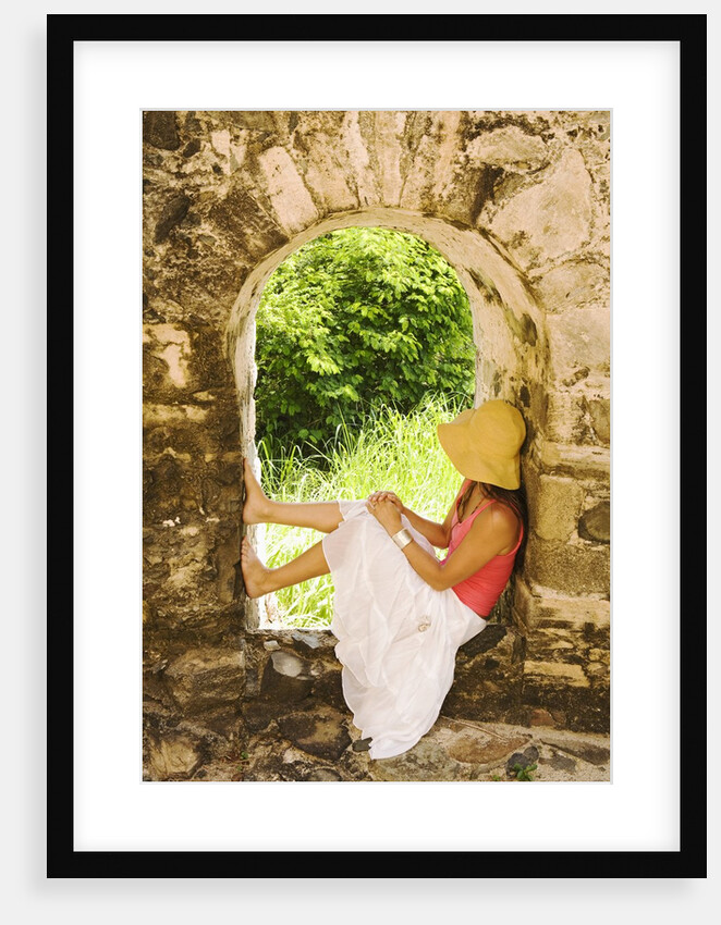Young Woman Sitting in Window in Old Stone Wall by Anonymous
