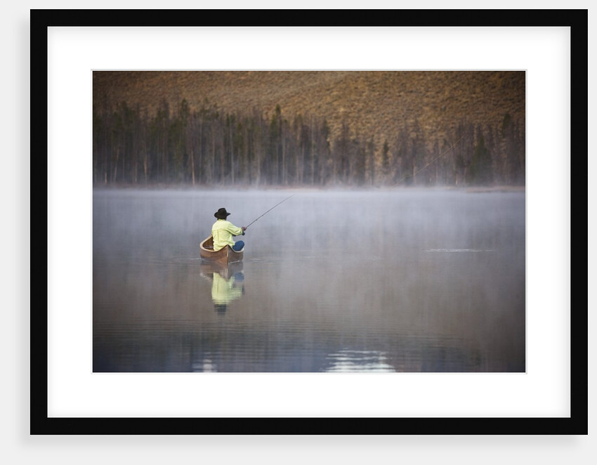 Man fishing on foggy lake by Anonymous