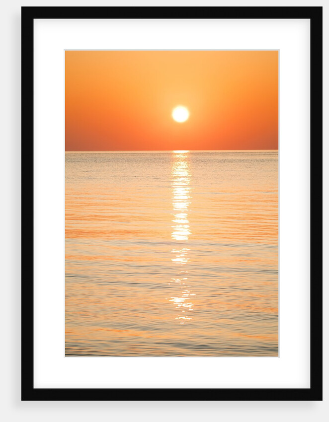 Sunlight reflecting on ocean at sunset by Anonymous