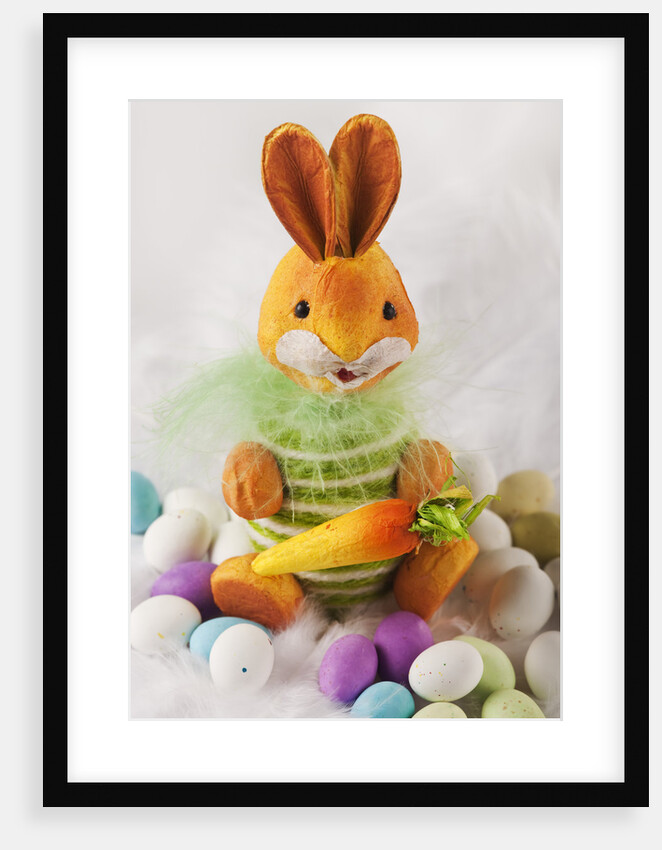 Toy bunny with candy eggs by Anonymous