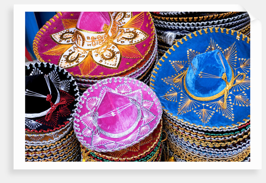 Stacks of souvenir sombreros by Anonymous
