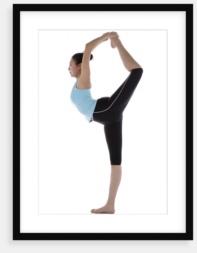 Female gymnast standing on one leg, holding other foot behind her head by Anonymous