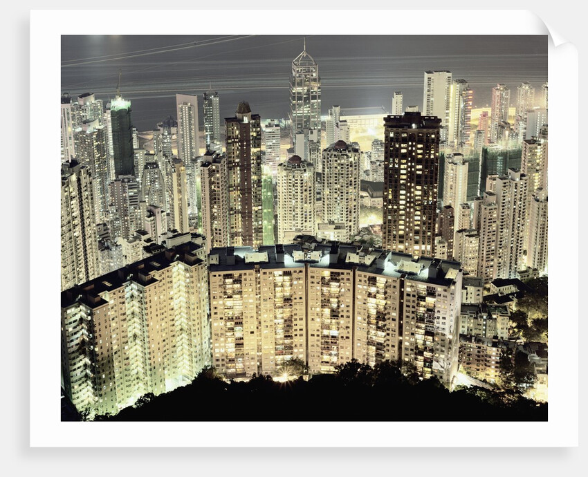 Hong Kong skyscrapers and apartment blocks at night by Corbis