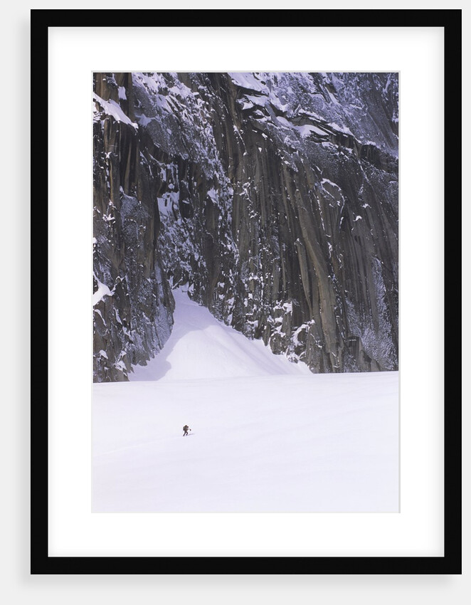 Backcountry Skier Underneath Snowpatch Spire, Bugaboos, British Columbia, Canada. by Anonymous