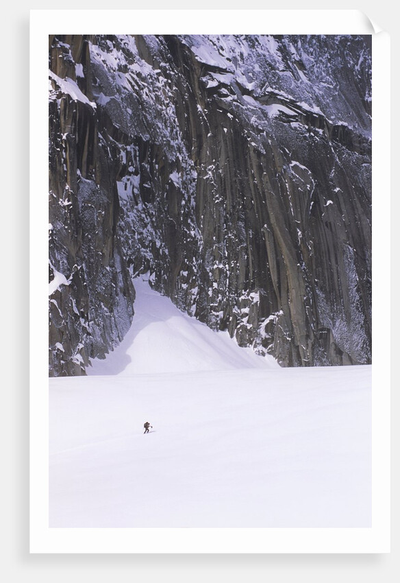 Backcountry Skier Underneath Snowpatch Spire, Bugaboos, British Columbia, Canada. by Anonymous