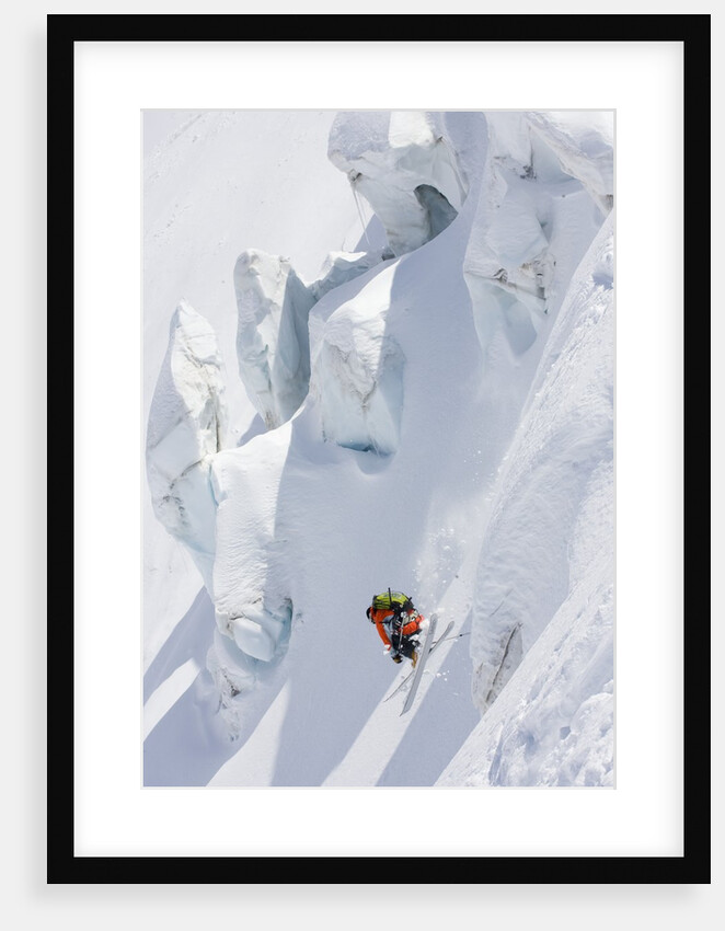 Backcountry skier in mid-jump by Anonymous