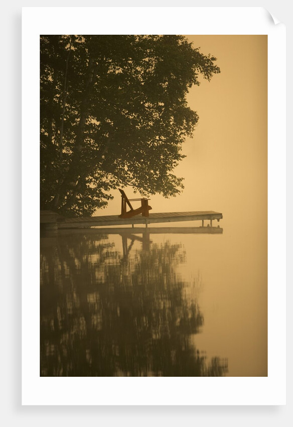 Adirondack chair on dock by Anonymous