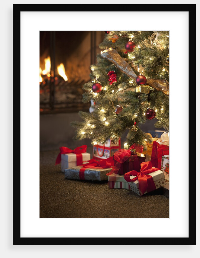 Christmas tree by fireplace by Anonymous