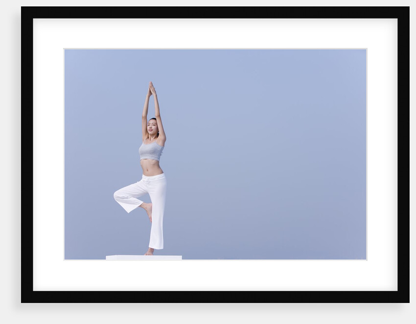 Young woman stretching by Anonymous