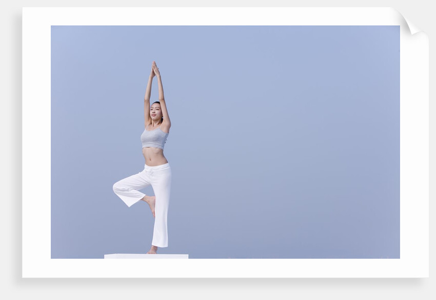Young woman stretching by Anonymous