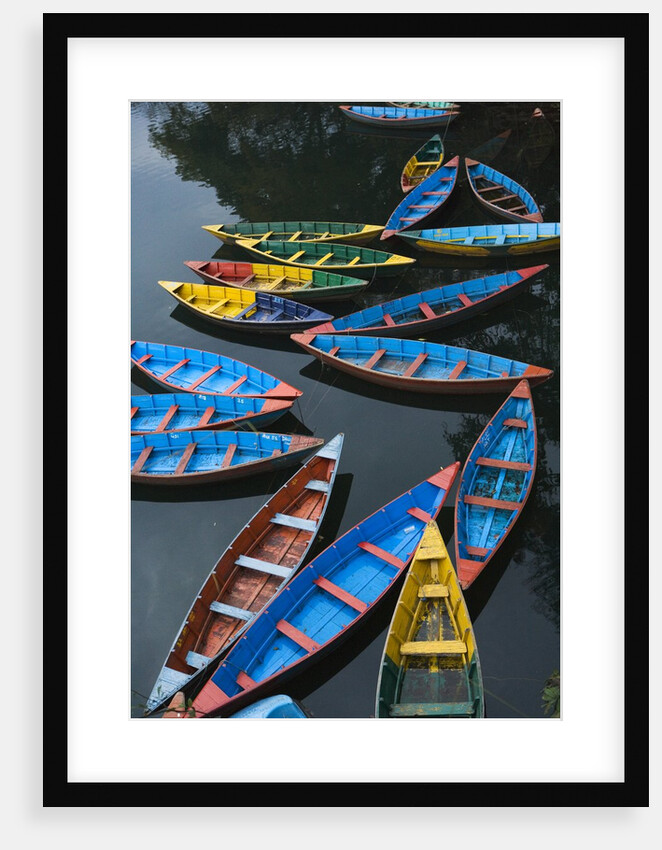 Canoes floating on water by Anonymous