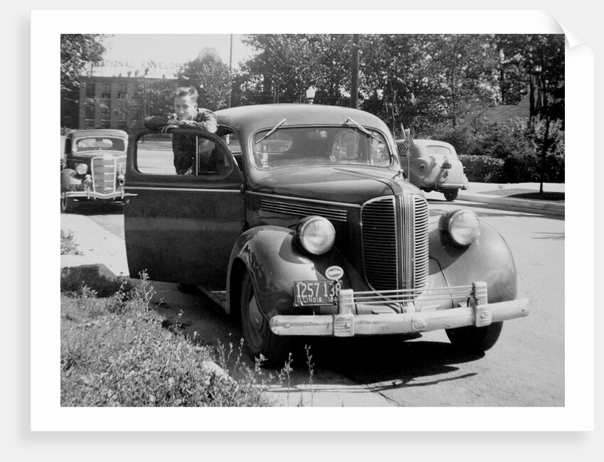 Eighteen year old boy with his first car, ca. 1944 by Anonymous