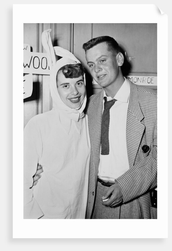 A couple on a date at a costume party pose, ca. 1955 by Anonymous