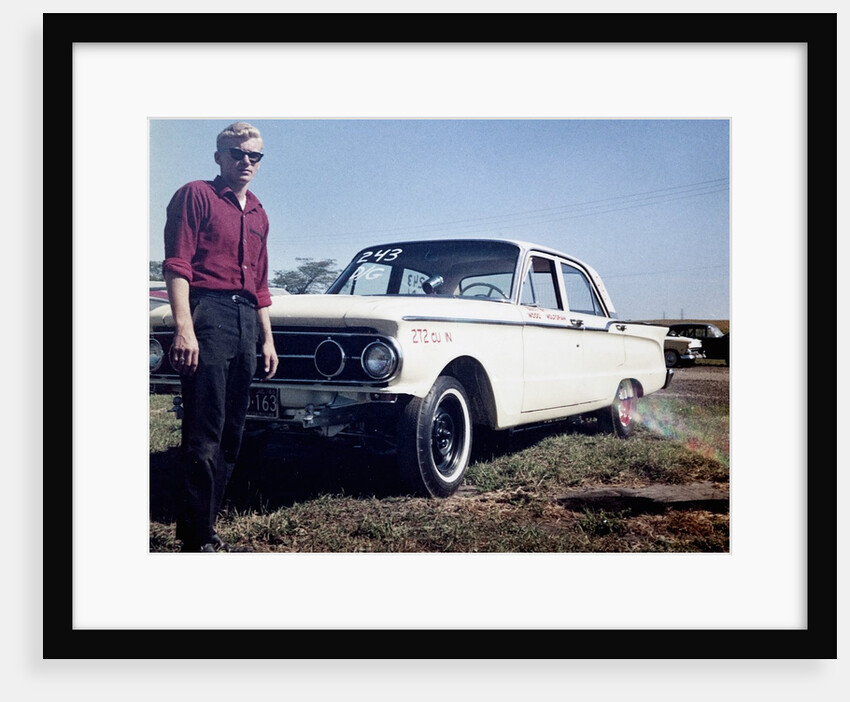 Sixteen year old boy stands with his 1960 Mercury Comet automobile, ca. 1962 by Anonymous