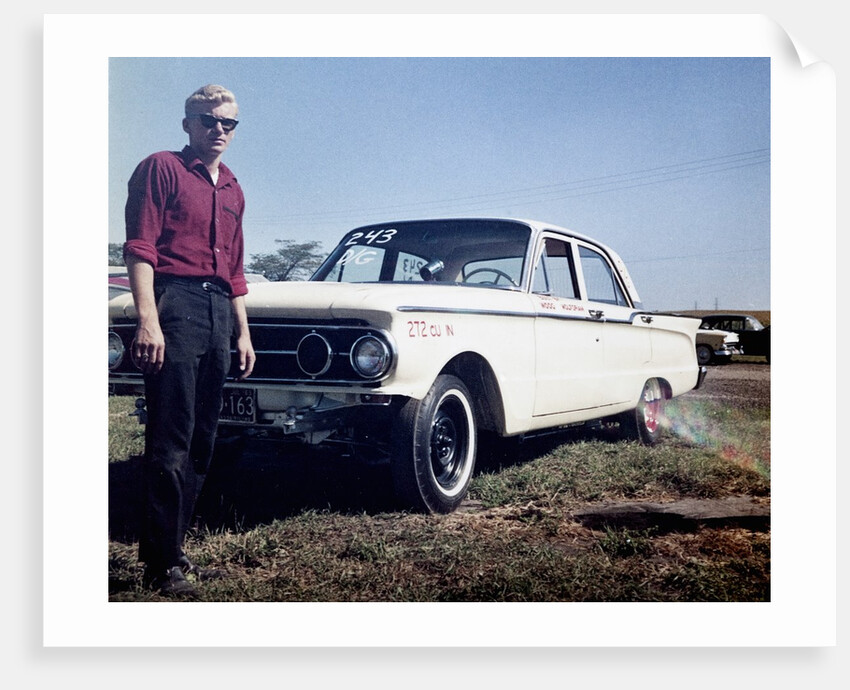 Sixteen year old boy stands with his 1960 Mercury Comet automobile, ca. 1962 by Anonymous