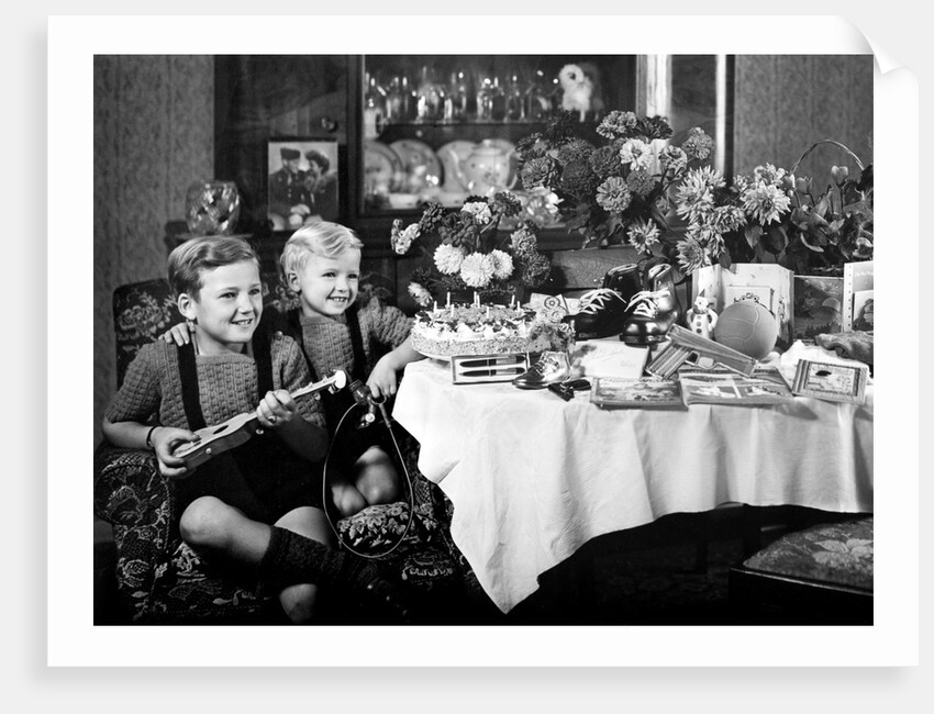 Brothers, ages 8 and 3, pose with birthday presents, ca. 1949 by Anonymous