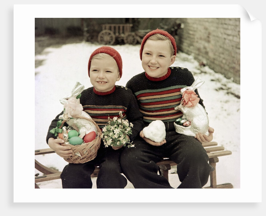 Two brothers sit with Easter decorations outside in Germany, ca. 1948 by Anonymous