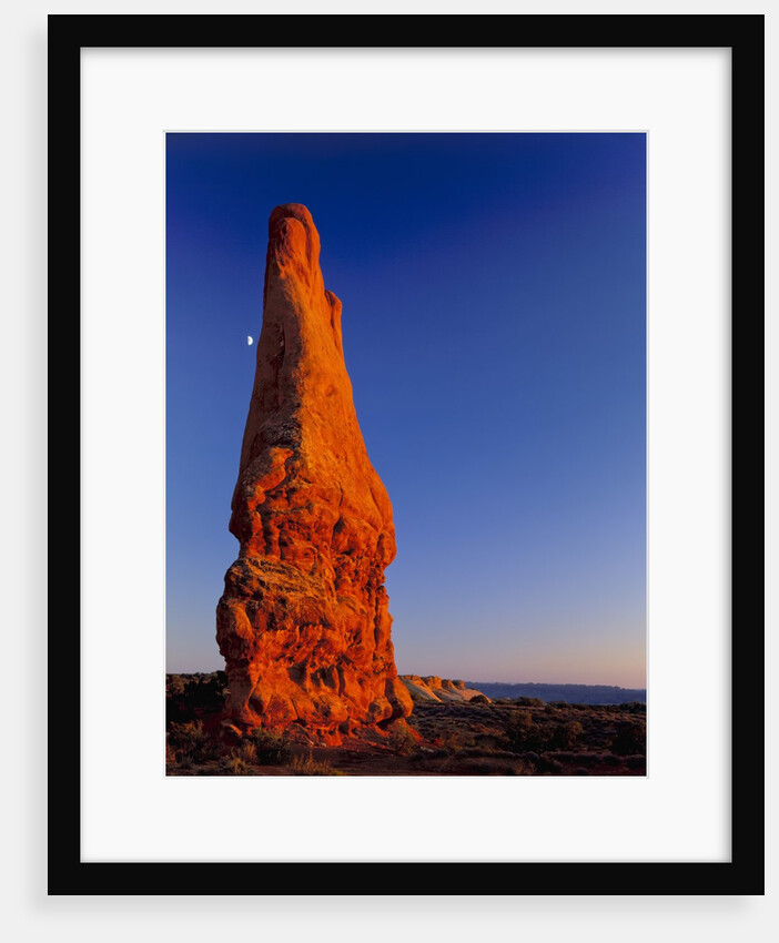 Moon and sandstone spire at Arches National Park by Anonymous