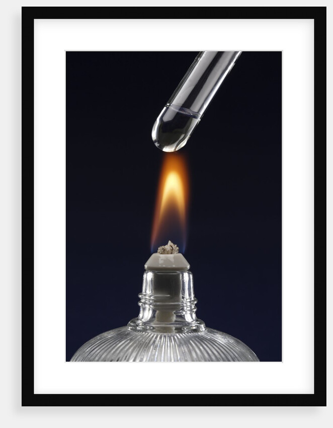 Test tube with liquid, over flame by Anonymous