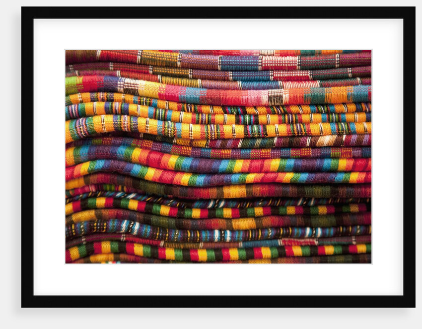 Textiles for sale in market in San Miguel de Allende by Anonymous