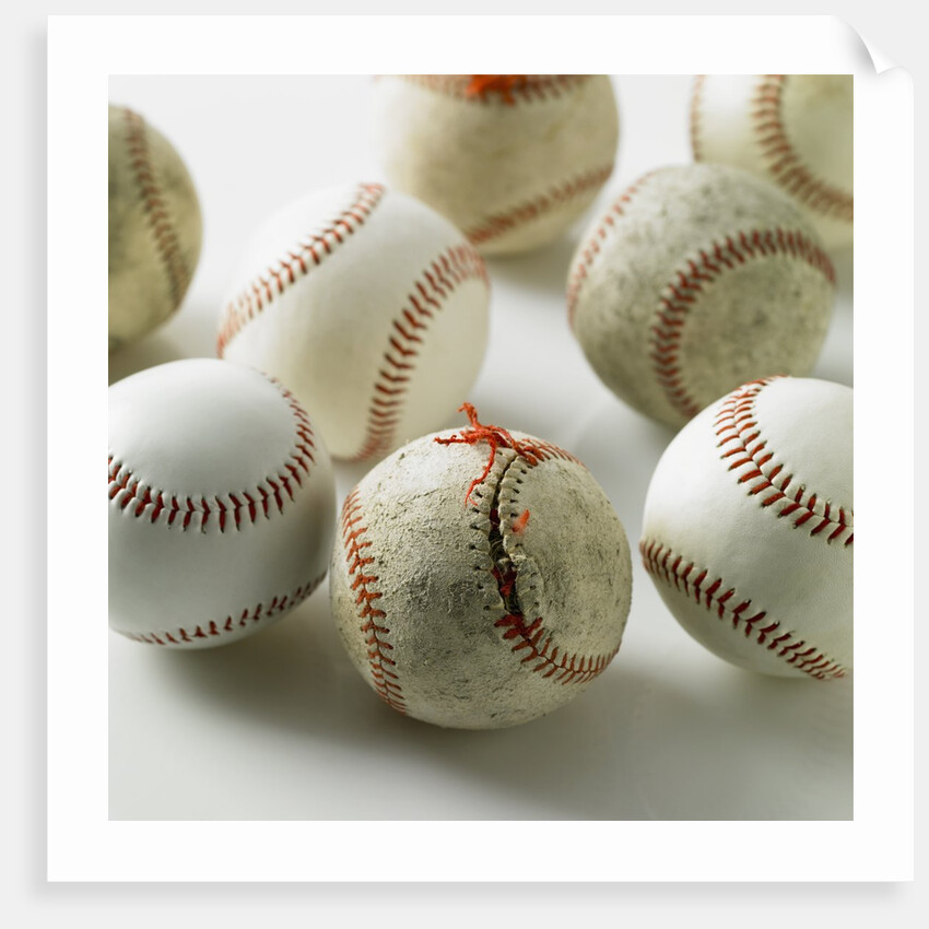 Old and new baseballs gathered together by Anonymous