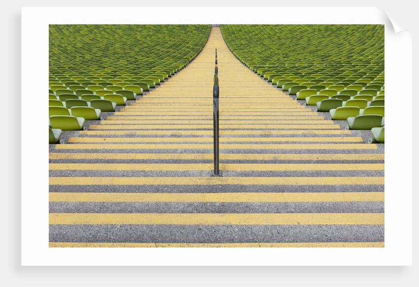 Stadium stairway between rows of green seats by Anonymous