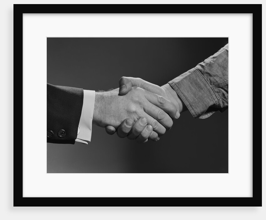 Close-up handshake between businessman and laborer by Anonymous