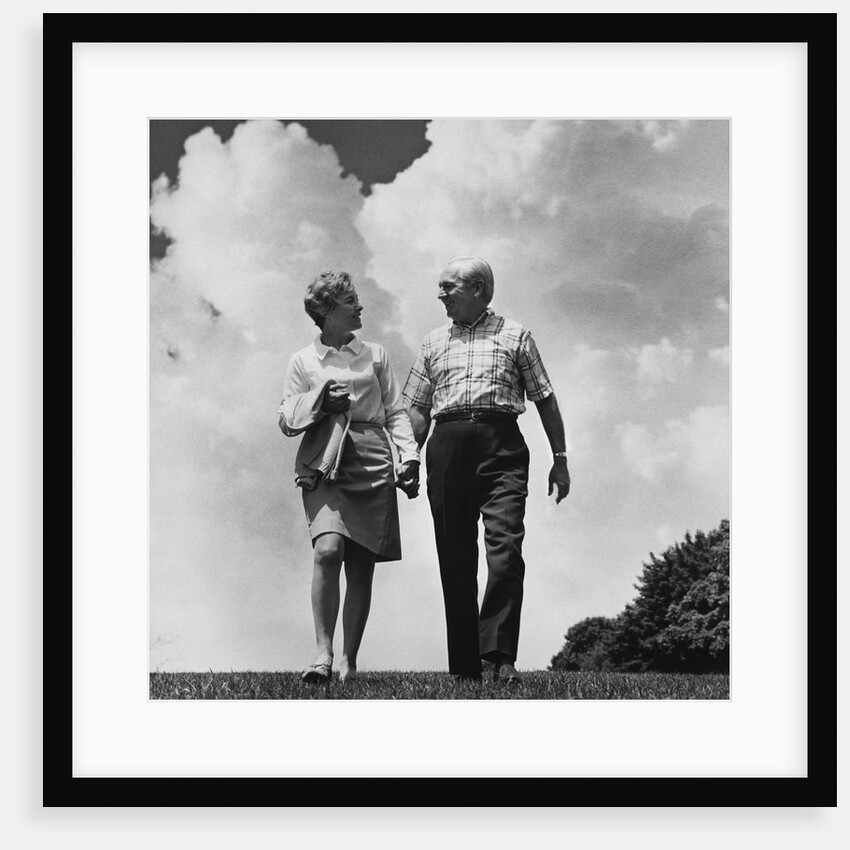 Mature couple walking holding hands by Anonymous