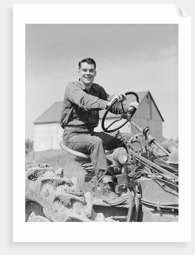 Smiling man farmer driving tractor by Anonymous