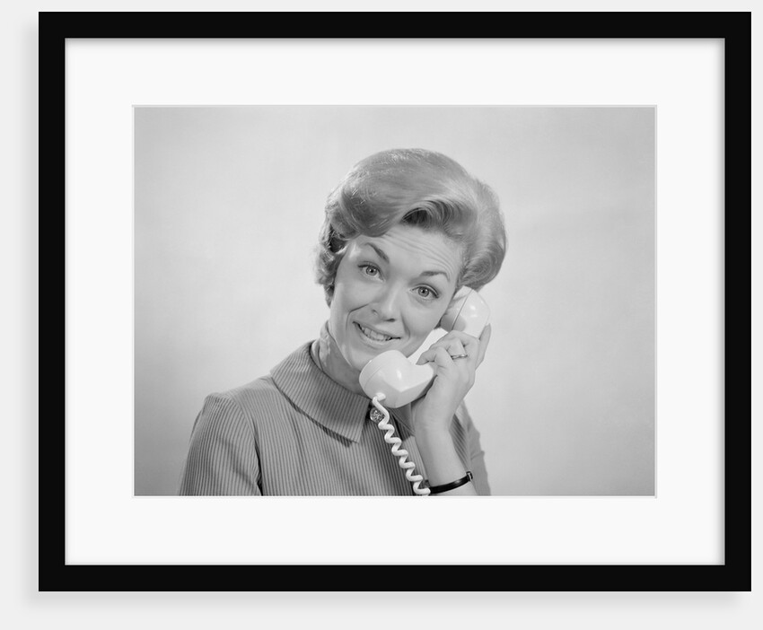 Portrait smiling woman talking on telephone by Anonymous