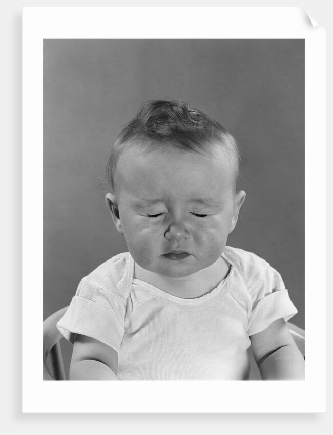 Portrait baby with eyes tightly closed by Anonymous