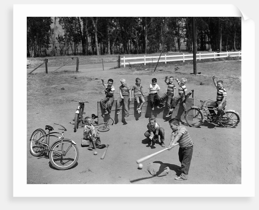10 neighborhood boys playing sand lot baseball most wear blue jeans tee shirts by Anonymous