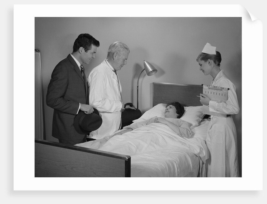 Doctor nurse husband talking with female patient in hospital bed by Anonymous
