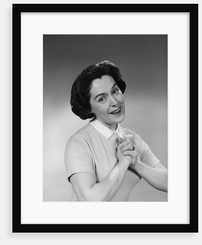 Brunette woman smiling happy satisfied proudly clasping hands to chest by Anonymous