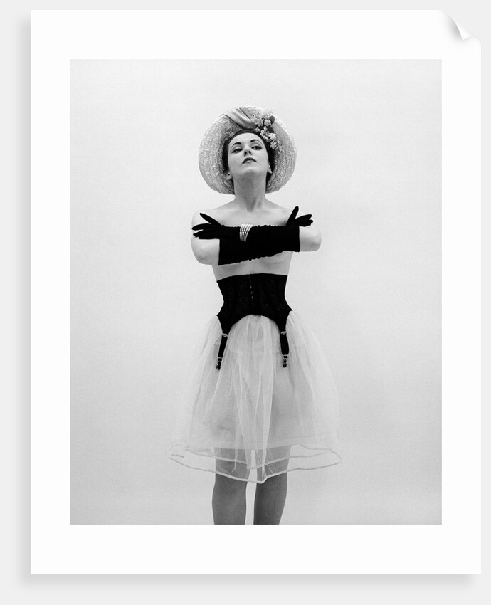 Woman topless wearing straw hat long gloves black garter belt arms folded in front by Anonymous